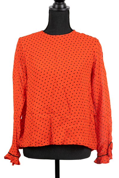 red and black polka dot blouse